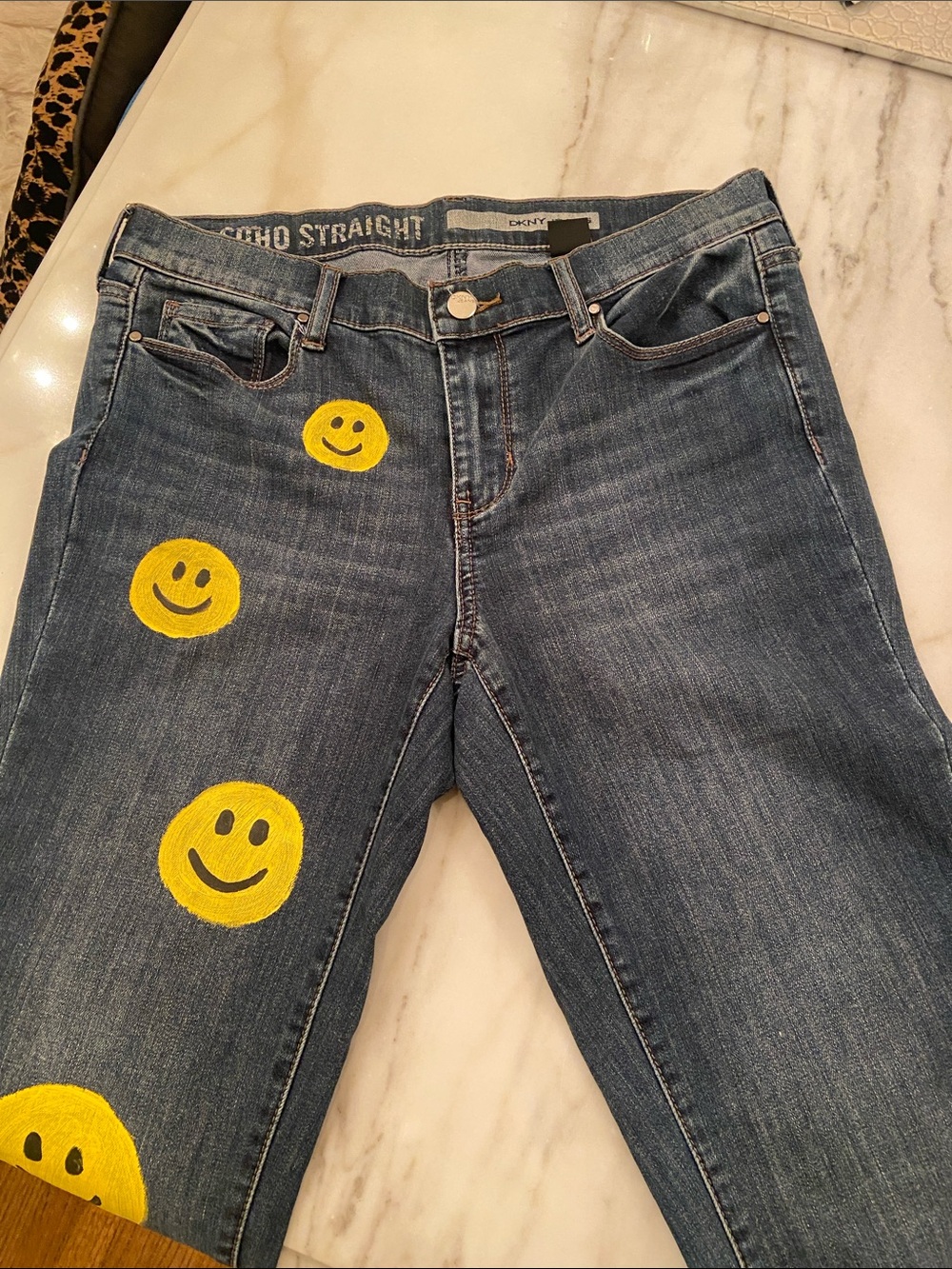 DKNY Blue Denim Jeans with Yellow Smiley Graphics